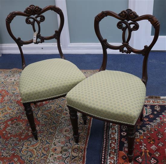 A set of six Victorian walnut dining chairs